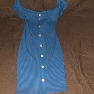 Fitted, flare top dress with button designs starting from the top down.